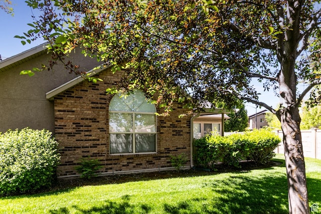 544 W 300 S Unit C, Springville, UT 84663 - view of front of house featuring a front yard, stucco siding, and brick siding