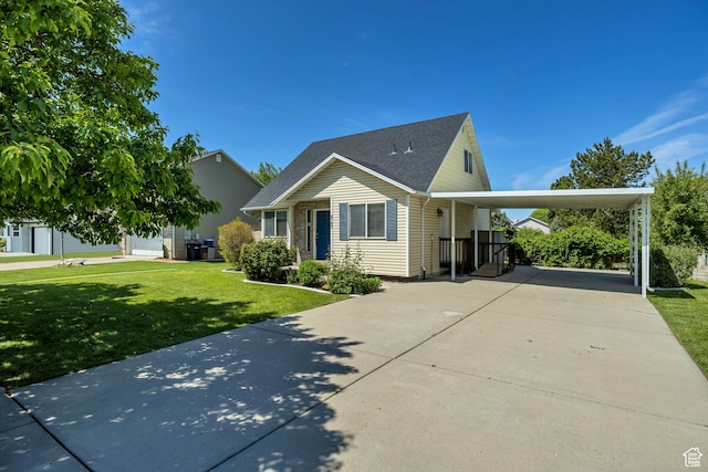 4733 S 3900 W, Roy, UT 84067 - view of front of home featuring concrete driveway, a front lawn, an attached carport, and roof with shingles