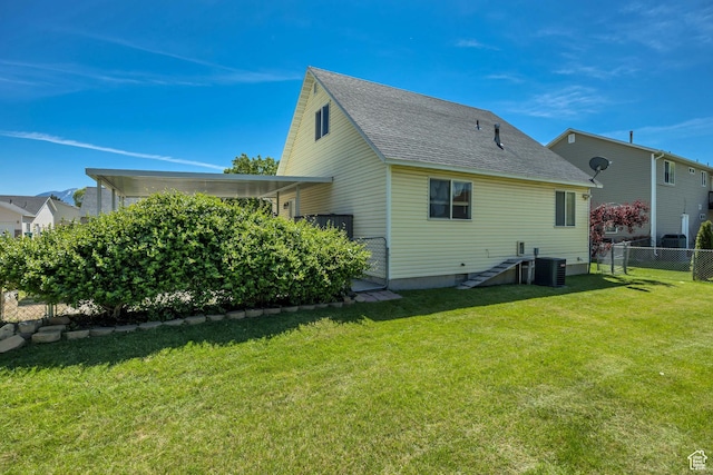 4733 S 3900 W, Roy, UT 84067 - rear view of property featuring cooling unit and a shingled roof