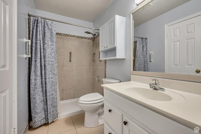 4733 S 3900 W, Roy, UT 84067 - bathroom with vanity, toilet, tile patterned floors, and tiled shower