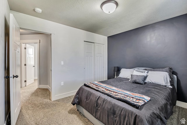 12884 S Tortoise Ln, Riverton, UT 84096 - bedroom featuring light carpet, a textured ceiling, a closet, and baseboards