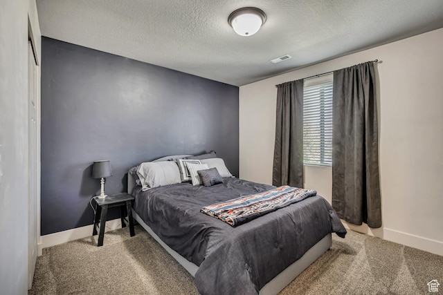 12884 S Tortoise Ln, Riverton, UT 84096 - bedroom with carpet flooring, a textured ceiling, and baseboards