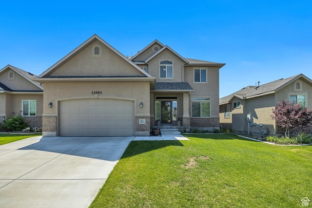 12884 S Tortoise Ln, Riverton, UT 84096 - traditional home with stucco siding, brick siding, an attached garage, concrete driveway, and a front lawn