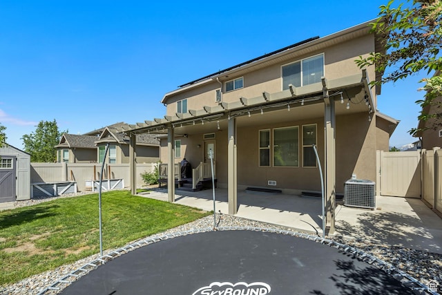 12884 S Tortoise Ln, Riverton, UT 84096 - back of property with stucco siding, a patio area, cooling unit, and a gate