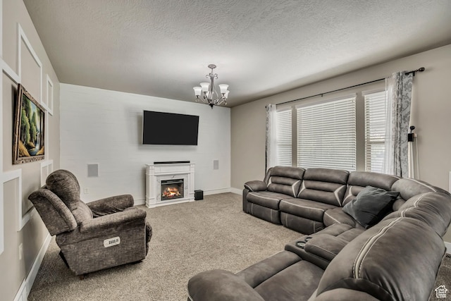 12884 S Tortoise Ln, Riverton, UT 84096 - living room with carpet flooring, a chandelier, a warm lit fireplace, a textured ceiling, and baseboards