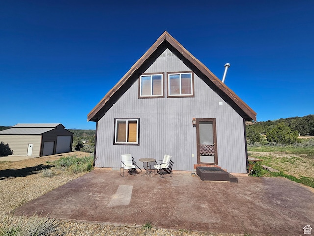 45465 W Airport Rd, Fruitland, UT 84027 - back of property with an outbuilding and a patio area