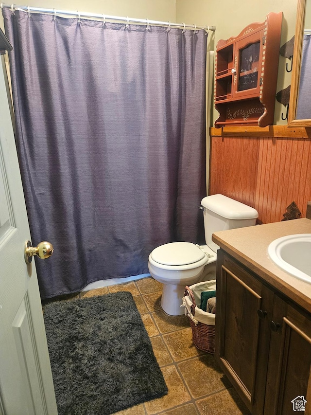 45465 W Airport Rd, Fruitland, UT 84027 - bathroom featuring toilet, vanity, tile patterned flooring, and a shower with shower curtain