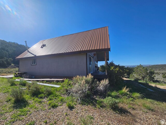 45465 W Airport Rd, Fruitland, UT 84027 - view of side of home with metal roof