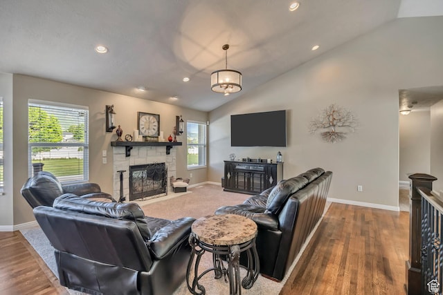 11743 S Silver Spur Ln, Draper, UT 84020 - living area featuring a stone fireplace, lofted ceiling, baseboards, recessed lighting, and wood finished floors