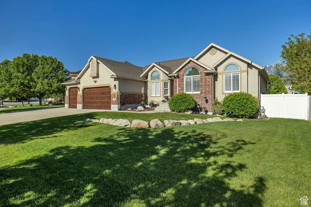 11743 S Silver Spur Ln, Draper, UT 84020 - single story home with stucco siding, a garage, concrete driveway, and brick siding