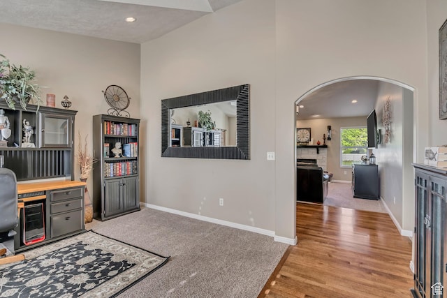 11743 S Silver Spur Ln, Draper, UT 84020 - home office with arched walkways, baseboards, light wood-type flooring, and recessed lighting