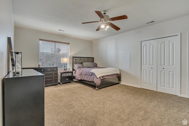 11743 S Silver Spur Ln, Draper, UT 84020 - bedroom featuring light carpet, a ceiling fan, a closet, and baseboards