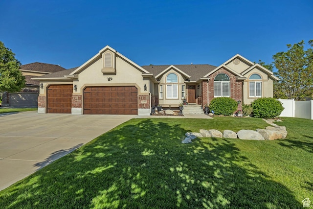 11743 S Silver Spur Ln, Draper, UT 84020 - ranch-style house with an attached garage, concrete driveway, stucco siding, and brick siding
