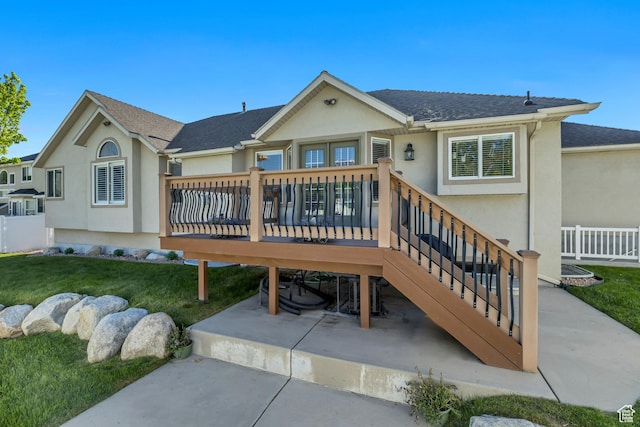 11743 S Silver Spur Ln, Draper, UT 84020 - back of house with stucco siding, a lawn, a wooden deck, and a patio area