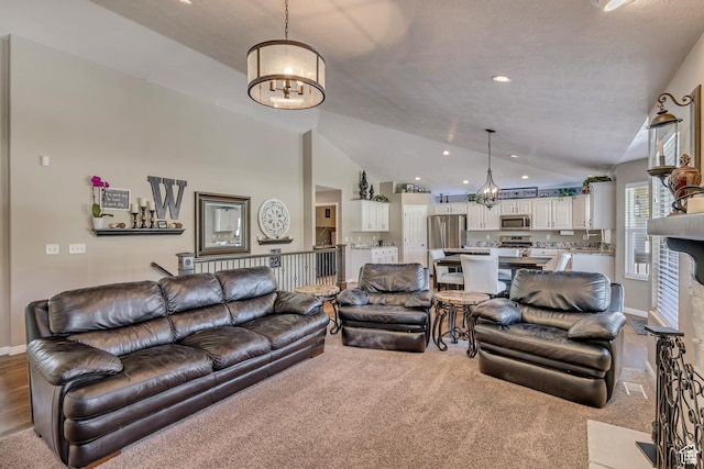 11743 S Silver Spur Ln, Draper, UT 84020 - carpeted living area with a chandelier, vaulted ceiling, baseboards, and recessed lighting
