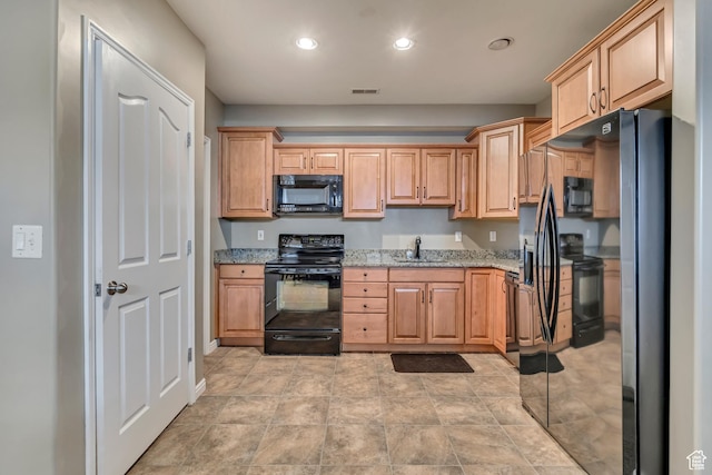 11743 S Silver Spur Ln, Draper, UT 84020 - kitchen featuring black appliances, light stone countertops, recessed lighting, a sink, and light brown cabinets