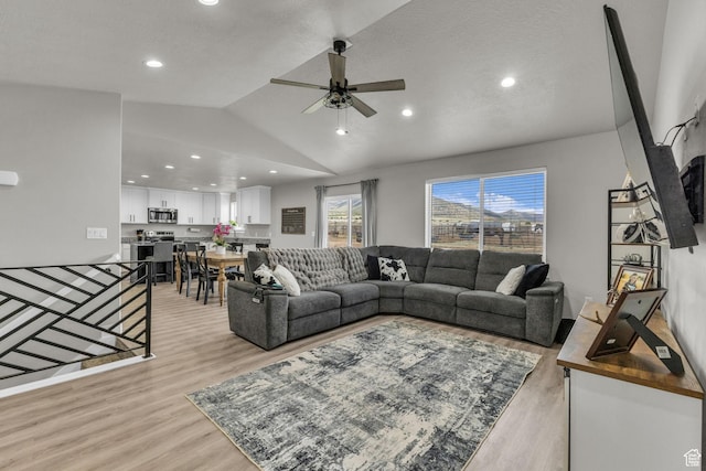 18616 Jefferson Ave, Eagle Mountain, UT 84013 - living area with light wood-style flooring, a ceiling fan, vaulted ceiling, and recessed lighting