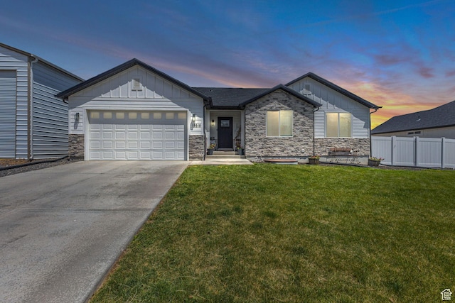 18616 Jefferson Ave, Eagle Mountain, UT 84013 - view of front of property with board and batten siding, stone siding, a garage, and concrete driveway