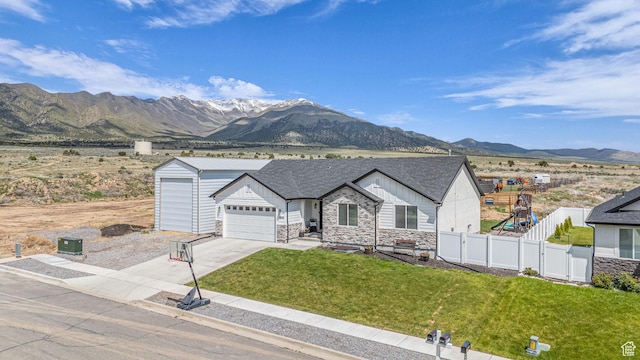 18616 Jefferson Ave, Eagle Mountain, UT 84013 - single story home with stone siding, driveway, a mountain view, and board and batten siding