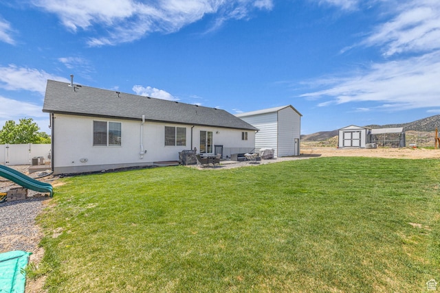 18616 Jefferson Ave, Eagle Mountain, UT 84013 - rear view of house featuring a patio, a playground, and central AC