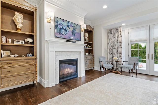 4731 S Marabow Cir, Holladay, UT 84117 - living area with a glass covered fireplace, ornamental molding, dark wood-type flooring, baseboards, and built in shelves