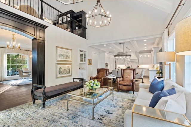 4731 S Marabow Cir, Holladay, UT 84117 - living area featuring a chandelier, wood finished floors, a towering ceiling, crown molding, and beam ceiling