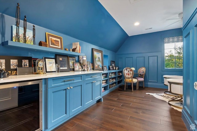 4731 S Marabow Cir, Holladay, UT 84117 - indoor dry bar featuring beverage cooler, lofted ceiling, and dark wood-style flooring