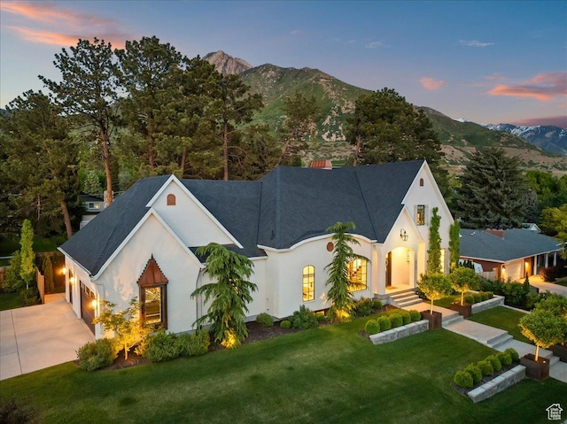 4731 S Marabow Cir, Holladay, UT 84117 - view of front facade with driveway, stucco siding, a mountain view, and a garage