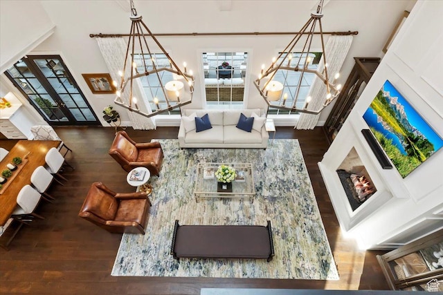 4731 S Marabow Cir, Holladay, UT 84117 - living room featuring a chandelier, hardwood / wood-style flooring, and a towering ceiling
