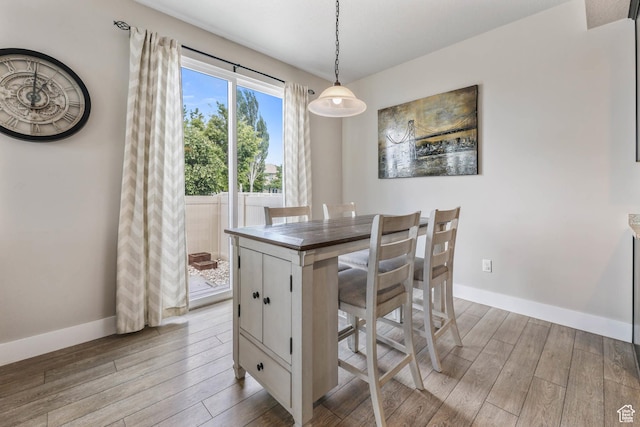 5564 W Baldrine Ct, Herriman, UT 84096 - dining room featuring light wood finished floors and baseboards