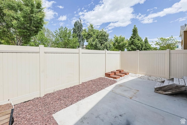 5564 W Baldrine Ct, Herriman, UT 84096 - fenced backyard with a patio