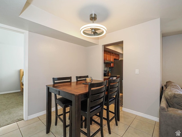 7208 S Station Creek Ln Unit 4B, Cottonwood Heights, UT 84047 - dining room with light tile patterned flooring and baseboards