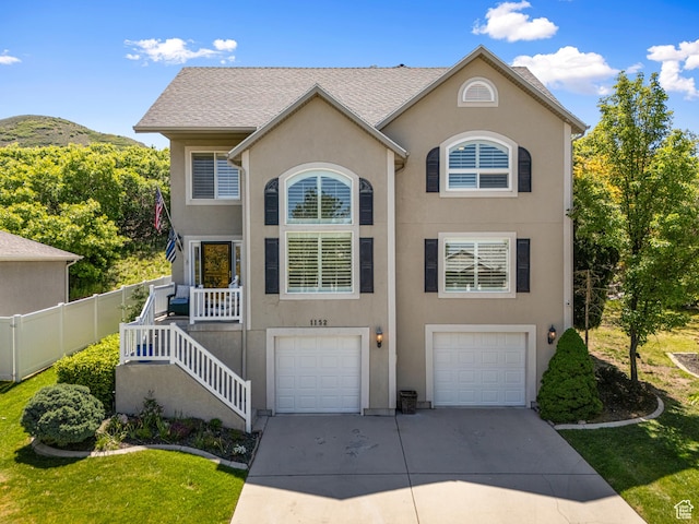 1152 E Gavin Cir, Draper, UT 84020 - view of front of home featuring concrete driveway, a garage, and stucco siding