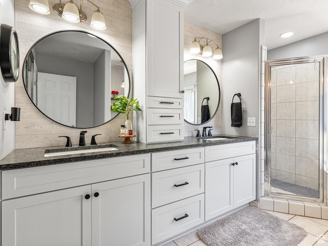 1152 E Gavin Cir, Draper, UT 84020 - full bath featuring double vanity, a stall shower, and tile patterned flooring