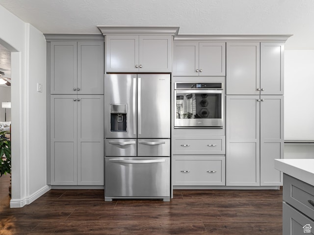 1152 E Gavin Cir, Draper, UT 84020 - kitchen with stainless steel appliances, gray cabinets, dark wood finished floors, arched walkways, and light countertops