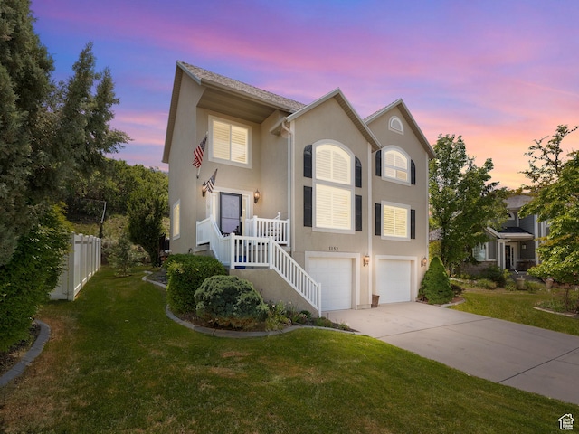 1152 E Gavin Cir, Draper, UT 84020 - view of front of home with stucco siding, concrete driveway, and a garage
