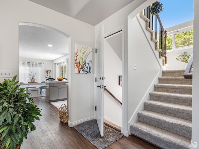 1152 E Gavin Cir, Draper, UT 84020 - stairs with hardwood / wood-style floors, arched walkways, recessed lighting, and baseboards