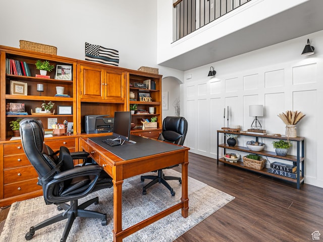 1152 E Gavin Cir, Draper, UT 84020 - office area featuring a high ceiling, dark wood finished floors, and arched walkways