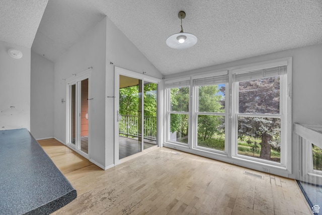 1054 E Lamplighter Dr, River Heights, UT 84321 - unfurnished sunroom featuring lofted ceiling and healthy amount of natural light
