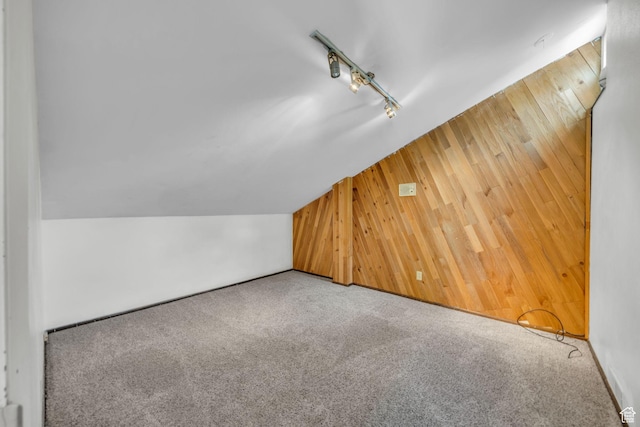 1054 E Lamplighter Dr, River Heights, UT 84321 - additional living space featuring wood walls, carpet, and lofted ceiling