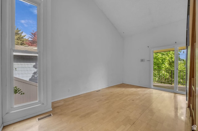 1054 E Lamplighter Dr, River Heights, UT 84321 - empty room with wood finished floors and high vaulted ceiling