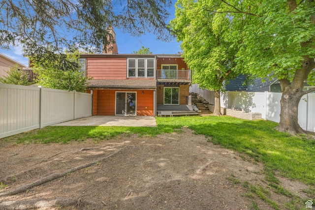 1054 E Lamplighter Dr, River Heights, UT 84321 - rear view of house featuring a patio, stairs, and a chimney