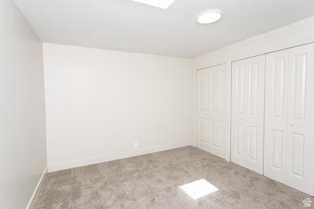 3644 S 860 E Unit 57, Salt Lake City, UT 84106 - unfurnished bedroom featuring carpet flooring, baseboards, and multiple closets