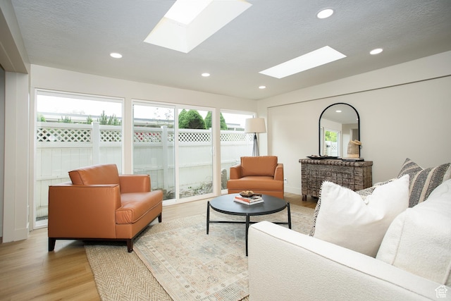 3644 S 860 E Unit 57, Salt Lake City, UT 84106 - living area with a skylight, light wood-style floors, recessed lighting, and lofted ceiling