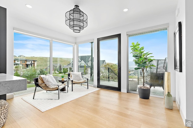 1620 W Brevia Ct Unit 25, Lehi, UT 84043 - sitting room featuring wood finished floors, recessed lighting, and a chandelier