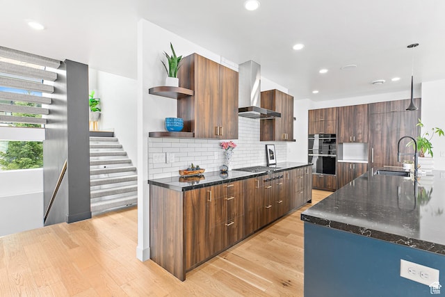 1620 W Brevia Ct Unit 25, Lehi, UT 84043 - kitchen with wall chimney exhaust hood, open shelves, modern cabinets, stainless steel double oven, and light wood-style flooring