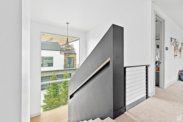 1620 W Brevia Ct Unit 25, Lehi, UT 84043 - stairway with a chandelier and baseboards