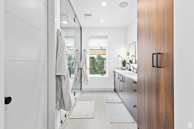 1620 W Brevia Ct Unit 25, Lehi, UT 84043 - bathroom with vanity, a shower stall, tile patterned flooring, recessed lighting, and baseboards