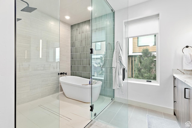 1620 W Brevia Ct Unit 25, Lehi, UT 84043 - bathroom featuring walk in shower, vanity, a freestanding tub, and tile patterned flooring