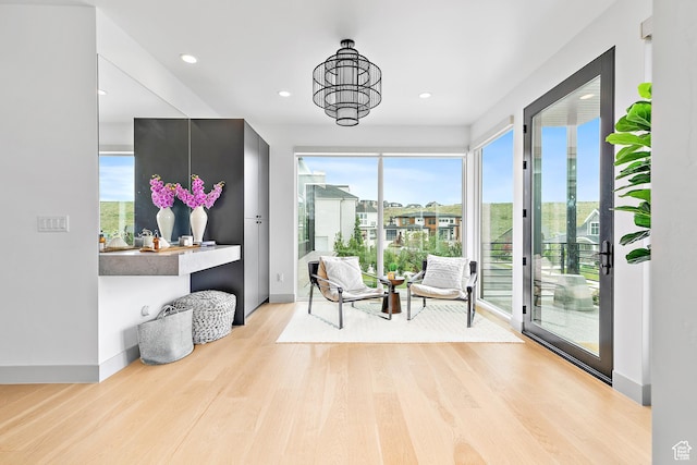 1620 W Brevia Ct Unit 25, Lehi, UT 84043 - sitting room with light wood-type flooring, baseboards, and recessed lighting